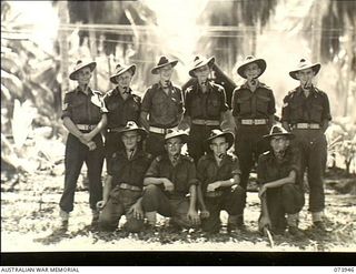 MADANG, NEW GUINEA. 1944-06-17. GROUP PORTRAIT OF THE STAFF OF THE INTELLIGENCE SECTION AT BATTALION HEADQUARTERS, 58/59TH INFANTRY BATTALION. THE UNIT IS LOCATED AT SIAR PLANTATION. LEFT TO RIGHT: ..
