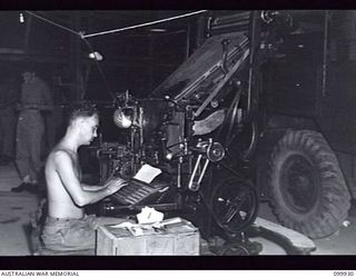 RABAUL, NEW BRITAIN, 1946-03-27. SERGEANT R. RADFORD OPERATING AN INTERTYPE MACHINE DURING THE PRODUCTION OF THE ARMY NEWSPAPER GUINEA GOLD. THE MACHINE WAS LIFTED DOWN FROM THE VEHICLE FOR ..