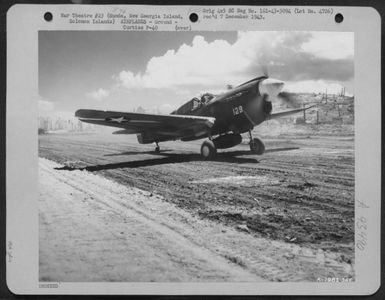 A Curtiss P-40 Lands At Munda Field, New Georgia Island, Solomon Islands After It Was Captured By The American Forces. 14 August 1943. (U.S. Air Force Number A79813AC)