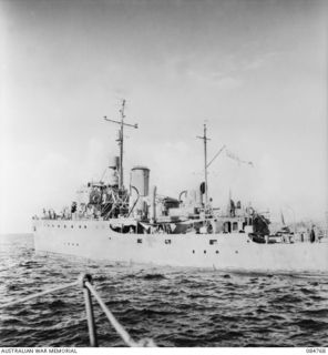 MIOS WUNDI, DUTCH NEW GUINEA. 1944-11-15. HMAS GLENELG, AT THE FOREGROUND, RECEIVES THE RETURN OF ITS TOW ROPE FROM HMAS STAWELL. AFTER UNSUCCESSFUL ATTEMPTS AT TOWING HMAS GLENELG FLOATED ITSELF ..