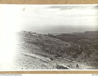 SATTELBERG, NEW GUINEA. 1943-11-29. PHOTOGRAPH SHOWING THE EFFECTS OF THE HEAVY BOMBING AND SHELLING IN THE AREA AROUND THE LUTHERAN CHURCH