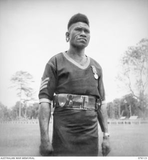 LAE, NEW GUINEA. 1944-09-12. NO. 3233 SERGEANT MERIRE, BEM, ROYAL PAPUAN CONSTABULARY, A NATIVE OF THE WARIA DISTRICT WHO HAS BEEN ASSOCIATED WITH THE POLICE FORCE FOR THE PAST 9 YEARS