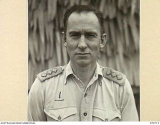 SEVENTEEN MILE, PORT MORESBY, PAPUA, NEW GUINEA, 1944-03-01. NX116631 CAPTAIN P.A. REID, GSO III, (INTELLIGENCE), HEADQUARTERS, NEW GUINEA FORCE