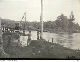 AITAPE, NORTH EAST NEW GUINEA. C. 1944-06. A NEW BRIDGE BEING BUILT ACROSS THE RAIHU RIVER BY NO. 7 MOBILE WORKS SQUADRON RAAF