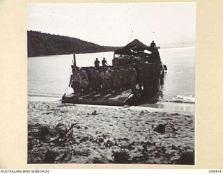 MUSCHU ISLAND, NEW GUINEA, 1945-09-11. JAPANESE PERSONNEL MARCHING OFF BARGE AT MUSCHU ISLAND. AN ADVANCE PARTY OF 63 OFFICERS AND OTHER RANKS OF THE JAPANESE ARMY AND NAVY WAS TRANSFERRED FROM ..