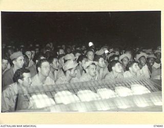 LAE, NEW GUINEA. 1944-07-24. A SECTION OF THE AUDIENCE DURING A CONCERT STAGED FOR THE TROOPS BY THE JACK BENNY SHOW
