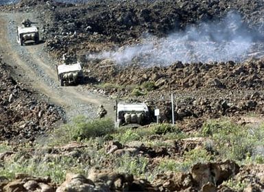 Marines from 2nd Battalion, 3rd Weapons, Company, fire a 50 Caliber gun from aboard their High-Mobility Multipurpose Wheeled Vehicles (HMMWV) during a Combined Arms Live Fire Exercise at Pohakuloa Training Area on the Big Island of Hawaii