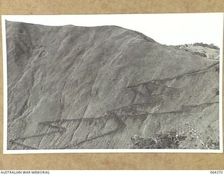 FINISTERRE RANGES, NEW GUINEA. 1944-01-22. THE MAIN TRACK BETWEEN GUY'S POST AND SHAGGY RIDGE WINDING UP THE SIDE OF A HILL IN THE RANGES