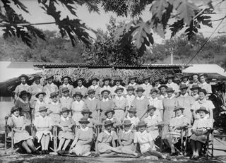 Port Moresby, Papua. 1944-08-08. Group portrait of Australian Army Nursing Service staff of 128th Australian General Hospital. Left to right: Back row: NFX135938 Lieutenant (Lt) H. N. Murphy; ..