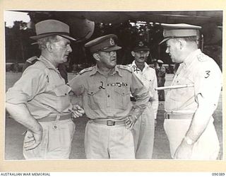 JACQUINOT BAY, NEW BRITAIN. 1945-04-08. SENATOR J.M. FRASER, ACTING MINISTER FOR THE ARMY (1), WITH MAJOR GENERAL A.H. RAMSEY (3), AND LIEUTENANT GENERAL J. NORTHCOTT, CHIEF OF THE GENERAL STAFF ..