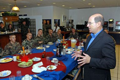 The Honorable Dr. Donald C. Winter (right), Secretary of the U.S. Navy (SECNAV), speaks with Seabees from Naval Mobile Construction Battalion 40, during a meet and greet breakfast at Camp Covington Galley onboard Naval Base Guam. The Seabees are currently deployed to Guam on Aug. 25, 2006. They also have detachments deployed in Iraq and Afghanistan. (U.S. Navy photo by Mass Communication SPECIALIST 2nd Class John F. Looney) (Released)