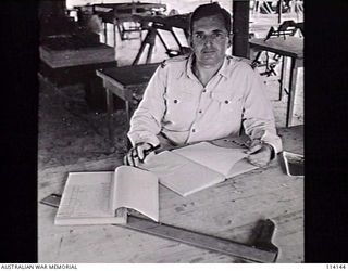 MOROTAI. 1945-08-22. FLYING OFFICER A. CRAIG-SMITH, RAAF, OFFICER COMMANDING THE DETACHMENTS COMPRISING THE CENTRAL INTERPRETATION UNIT, AIF. THE UNIT HAS SECTIONS IN BRISBANE, MOROTAI AND LAE