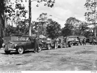 LAE BASE AREA, NEW GUINEA. 1944-12-04. A LINE-UP OF THE VARIED TYPES OF VEHICLES WHICH ARE REPAIRED BY THE 2/77TH LIGHT AID DETACHMENT SHOWING A 3 TON 4 X 4 TRUCK, JEEP, STAFF CAR AND A CAPTURED ..