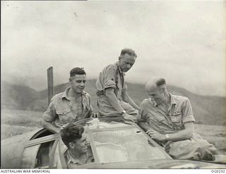 MILNE BAY, PAPUA. C. 1943-11-15. "TOO CLOSE FOR COMFORT" SAYS FLIGHT SERGEANT (FLT SGT) RON CAFFIN OF ORMOND, VIC (RIGHT), PILOT OF A BEAUFORT BOMBER AIRCRAFT OF NO. 100 SQUADRON RAAF POINTING TO A ..