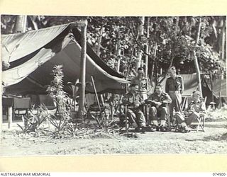 Madang, New Guinea. 1944-07-30. Officers of the 15th Infantry Ambulance at Matupi. Identified personnel are:- VX108488 Major M.M. Rosefield (1); VX82092 Lieutenant D.J. Cowan (2); VX220 ..