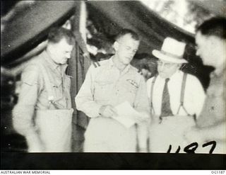 AITAPE, NORTH EAST NEW GUINEA. C. 1944-06. AT HEADQUARTERS NO. 10 GROUP RAAF, LEFT TO RIGHT: JOHN DEDMAN, THE MINISTER FOR WAR ORGANISATION OF INDUSTRY, AIR COMMODORE F. R. W. SCHERGER, THE AIR ..