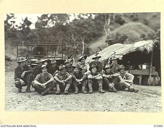 DUMPU, NEW GUINEA. 1944-04-20. PERSONNEL OF THE TRANSPORT SECTION OUTSIDE THEIR OFFICE AT HEADQUARTERS 15TH INFANTRY BRIGADE. IDENTIFIED PERSONNEL ARE:- VX89807 PRIVATE B. MADILL (1); Q147698 ..