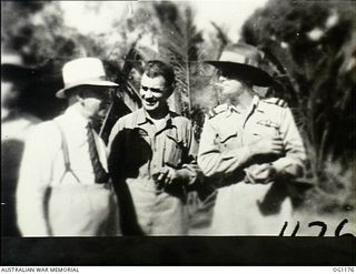 AITAPE, NORTH EAST NEW GUINEA. C. 1944-06. LEFT TO RIGHT: ARTHUR DRAKEFORD, THE MINISTER FOR AIR, JOHN DEDMAN, THE MINISTER FOR WAR ORGANISATION OF INDUSTRY, AND AIR COMMODORE F. R. W. SCHERGER, ..