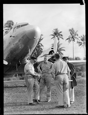A C47 crew in front of a transport plane, Faleolo Airport, Western Samoa
