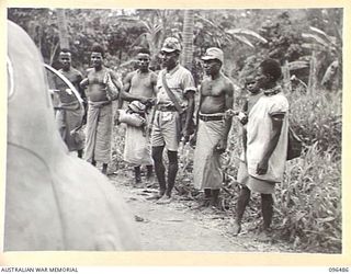 RABAUL, NEW BRITAIN, 1945-09-12. A PARTY OF NATIVES SAID TO HAVE WORKED FOR THE JAPANESE IN THE TUNNEL HILL ROAD AREA, ADJACENT TO RABAUL, PRIOR TO THE ARRIVAL OF AN AUSTRALIAN FORCE DRAWN FROM 4 ..