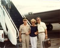 Two people posing with a pilot