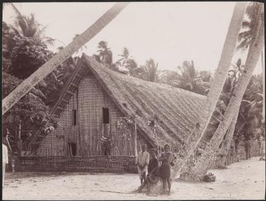 Three children standing in front of the church at Longapolo, Gaeta, Solomon Islands, 1906 / J.W. Beattie