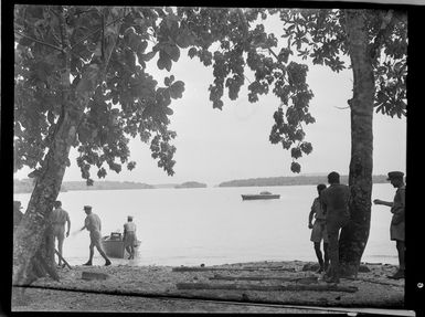 Group of unidentified RNZAF airmen standing on a beach, Espiritu Santo, New Hebrides (Vanuatu)