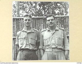 SALAMAUA AREA, NEW GUINEA. 1945-04-24. MAJOR TOMPSON, DISTRICT OFFICER (1), WITH CAPTAIN BOYS, DENTAL OFFICER, 2/8TH COMMANDO SQUADRON (2) HEADQUARTERS NEW GUINEA FORCE