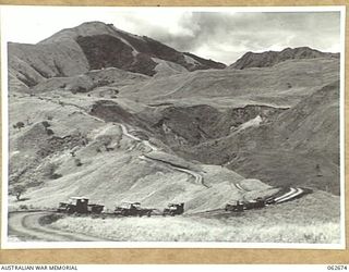 LAKE ROAD, FINISTERRE RANGES, NEW GUINEA. 1943-12-21. A SECTION OF LAKE ROAD IN THE FOOTHILLS OF THE FINISTERRE RANGES WHICH WAS BUILT BY THE ROYAL AUSTRALIAN ENGINEER UNITS OF THE 7TH AUSTRALIAN ..