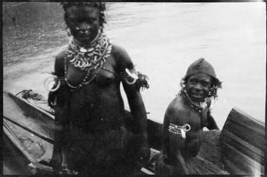 Two people standing in a canoe, Ramu River, New Guinea, 1935, 2 / Sarah Chinnery
