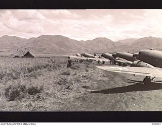 NADZAB AIRSTRIP, NEW GUINEA. 1943-09-19. TRANSPORT AIRCRAFT LINED UP ON NO. 2 AIRSTRIP WAITING TO BE UNLOADED