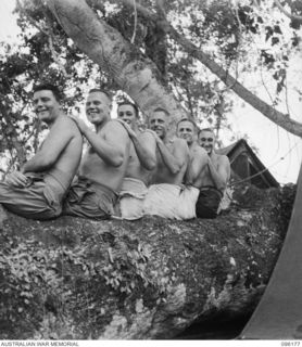 BRANDI, NEW GUINEA, 1945-09-07. ORIGINAL MEMBERS OF 35 INFANTRY BATTALION. IDENTIFIED PERSONNEL ARE:- SERGEANT L.W. O'SHANNESSY (1); STAFF-SERGEANT A. COLBY (2); CORPORAL H. HINDS (3); CAPTAIN ..