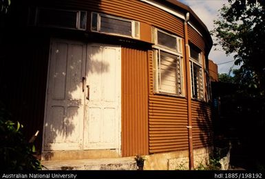 New Caledonia - curved orange house, white door