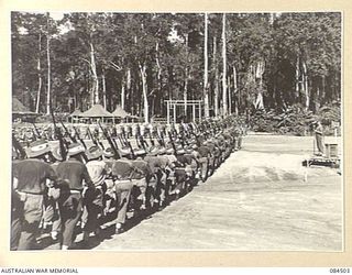 BOUGAINVILLE, SOLOMON ISLANDS, 1944-12-21. A COMPANY, 42 INFANTRY BATTALION, PASSING THE SALUTING DAIS DURING THE MARCH PAST. THE SALUTE WAS TAKEN BY MAJOR-GENERAL W. BRIDGEFORD, GENERAL OFFICER ..