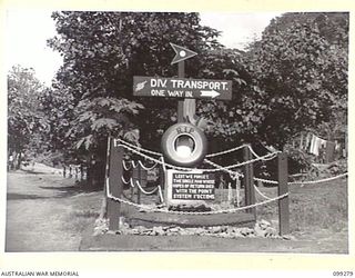 RABAUL, NEW BRITAIN, 1945-12-01. A SELF EXPLANATORY EPITAPH ERECTED IN THE TRANSPORT LINES AT 11 DIVISION, INDICATING GOOD HUMOUREDLY THE DISCRIMINATION AGAINST SINGLE MEN ON THEIR EARLY RETURN TO ..