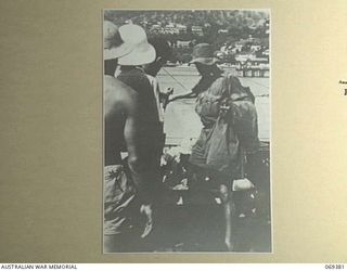 PORT MORESBY, NEW GUINEA. 1942-04-12. ONE OF THE EVACUEES FROM NEW BRITAIN LEAVING THE HMAS "LAURABADA". HE AND OTHER EVACUEES TOOK TO THE JUNGLE FOLLOWING THE SUCCESSFUL JAPANESE LANDING AT RABAUL ..