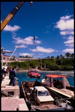 Cars on a barge at wharf, Niue