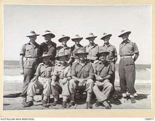 BORAM, NEW GUINEA. 1945-11-21. INFORMAL GROUP PORTRAIT OF BATTALION HEADQUARTERS OFFICERS OF 30TH INFANTRY BATTALION