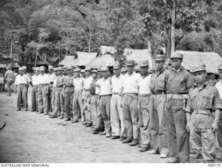 RABAUL, NEW BRITAIN, 1945-11-30. CHINESE SOLDIERS ASSEMBLED READY FOR THE IDENTIFICATION PARADE OF SUSPECTED JAPANESE WAR CRIMINALS, AT THE CHINESE ARMY CAMP