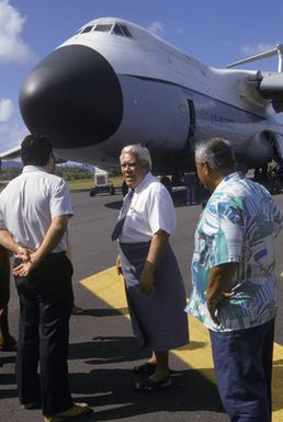 Somoan Governor A.P. Lutali greets the 22nd Military Airlift Squadron C-5 Galaxy aircraft at the Pago Pago International Airport along with other local officials and reporters. The aircraft is carrying an emergency electrical generator and equipment