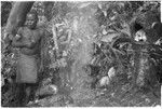 Man in shrine with skulls