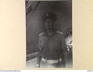 BORAM BEACH, WEWAK AREA, NEW GUINEA. 1945-08-30. BRIGADIER M.A. FERGUSSON, COMMANDER 8 INFANTRY BRIGADE, AT HEADQUARTERS 8 INFANTRY BRIGADE