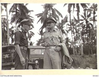 PALMALMAL PLANTATION, NEW BRITAIN, 1945-06-23. MAJ W.G.N. ORR, DEPUTY ASSISTANT QUARTERMASTER GENERAL, 11 DIVISION (1) WHO HAS BEEN IN NEW BRITAIN FOR SOME TIME, GREETING LT COL A.P. CHAPMAN, ..