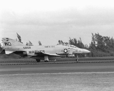 Right side view of an F-4 Phantom II aircraft from Marine Fighter Squadron 212 (VMFA-212) preparing to take off during an Alpha Strike exercise