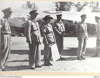 TOROKINA, BOUGAINVILLE. 1945-04-01. LORD WAKEHURST AND THE VICE REGAL PARTY ON PIVA AIRSTRIP AT THE CONCLUSION OF THEIR TOUR OF THE AREA, PRIOR TO THEIR DEPATURE FOR TOWNSVILLE