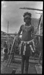 Adamase, a Motu woman of Gaile village, wearing crescent kina shell valuable necklace, jewelry, and head piece