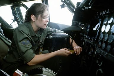 A ground crew member performs postflight maintenance on the instrument panel of a B-52H Stratofortress aircraft during Exercise Glad Customer '82