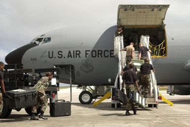 U.S. Air Force Airmen from the 613th Security Forces Squadron, 613th Contingency Response Group, load their cargo and equipment on a KC-135 Stratotanker aircraft at Andersen Air Force Base, Guam on Dec. 29, 2004 before deploying to Thailand in support of tsunami relief operations. The Airmen are bound for Southeast Asia as part of a disaster relief operation following a 9.0 magnitude earthquake that struck off the coast of Indonesia causing a tsunami that have affected 12 countries and has killed at least 100,000 people. (USAF PHOTO by STAFF SGT. Bennie J. Davis III) (Released)