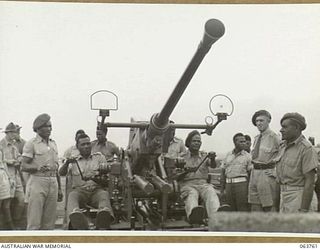 SYDNEY, NSW. 1944-01-26. AUSTRALIAN AND NEW GUINEA ADMINISTRATION UNIT NATIVES OPERATING A BOFORS 40MM ANTI AIRCRAFT GUN OF THE 655TH LIGHT ANTI-AIRCRAFT BATTERY