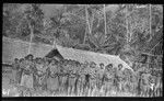 Makira women and infants near houses, at Star Harbour